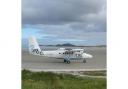 SANDY LANDING: A plane on the seaside runway on Barra, which opened at the same time as Gatwick.