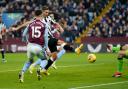 Fabian Schar stabs home Newcastle's second goal at Villa Park