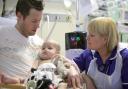 Kept Alive: 18-month-old Scarlett Ungurs, who needs a new heart, with dad Darren, and transplant co-ordinator Lynne Holt