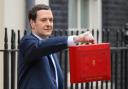 Chancellor George Osborne outside 11 Downing Street ahead of his Budget speech