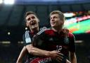 REMARKABLE DISPLAY: Toni Kroos celebrates scoring the fourth goal of Germany's 7-1 win over Brazil with team-mates Sami Khedira and Miroslav Klose