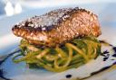 Ginger-glazed salmon with cucumber spaghetti and spring onion crème fraîche