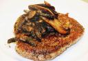Pepper and mustard rib-eye steak with fried mushroomsthere