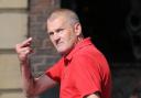OBSCENE: Peter Scotter gestures to waiting photographers at an earlier hearing outside Newcastle Crown Court