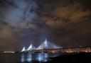 A view of the new Queensferry Crossing, seen from South Queensferry, as it is illuminated ahead of it's official opening by Queen Elizabeth II on September 4, 2017