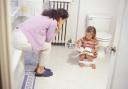 A mother potty training her daughter... but would you pay somone else to do the training?