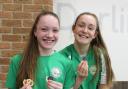 STAR SWIMMERS: Harriet Rogers with her five medals and Molly Mooney