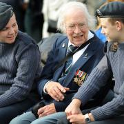Hero's tales: Raymond Thomas, from Newcastle, who flew Halifax bombers during the Second World War, chats with Air Cadets Thomas Wilson, left, and Jonathan Furness, both 16, before the parade at the Yorkshire Air Museum, Elvington, near York