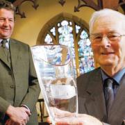 FAREWELL: Bill Carvey, who served as Church warden at St Mary’s, is presented with a vase by Sir Mark Wrightson to mark his retirement after 40 years