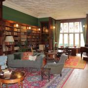 1.	The large Library at Kiplin Hall, with book lined walls, bright stained-glass windows and comfy furnishings.