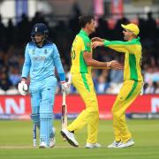 Australia's Mitchell Starc celebrates taking the wicket of Joe Root during the World Cup match at Lord's last summer