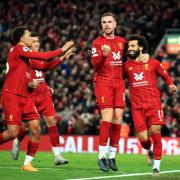 Jordan Henderson celebrates with his Liverpool team-mates - the Wearsider has been a key part of the Reds' title triumph