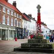 REMEMBER: Market Cross in Northallerton High Street has been covered with knitted poppies Picture: SARAH CALDECOTT.