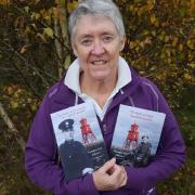 Transcriber and editor Effie Cadwallader with copies of her father's memoirs