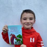 Jacob Carnes with his published book which is available to buy on Amazon and Ebook