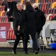 Newcastle manager Steve Bruce shakes hands with Brentford boss Thomas Frank in the wake of his side's Carabao Cup defeat