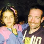 Brendan Woodhouse, above and below, pictured with one of the many refugees that arrived at Lesbos