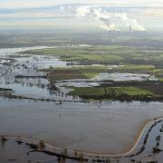 Floodwater covers land around Cawood, North Yorkshire after the River Ouse burst its banks. PRESS ASSOCIATION Photo. Picture date: Sunday December 27, 2015. The Prime Minister has promised to send more troops to "do whatever is needed" to help