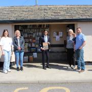 Rishi Sunak at the Scorton Bus Shelter book store – a history of the Stockton and Darlington Railway - with the Bus Shelter Buddies; from left, Sophie Newall, Linda Hutchinson, Kathy Bryan and Andy Young – with Harris