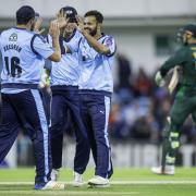 Azeem Rafiq is congratulated while playing for Yorkshire