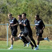 BACK IN BUSINESS: Terry stretches out in training alongside Dawson, Johnson and Carragher yesterday morning in Rustenburg. Picture: GETTY IMAGES