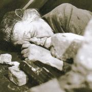 BADLY INJURED: Ena Sharples, played by Violet Carson, lies injured in rubble after a train crashed off the viaduct