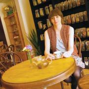 VINTAGE CHARM: Carli McNaught in The Olde Young Tea House. Above left, a sign captures the ambience