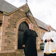NEW PARISH PRIEST: Father John Livesley, right, with father-in-law Father Peter Anderton, outside St Andrew’s Church, Tudhoe Grange