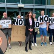 Cllr Eddy Adam (inset) spoke at a public inquiry which was also attended by protestors against the proposed Merchant Park incinerator.