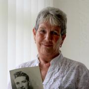 LOST SIBLING: Hazel Pritchard holds a treasured photograph of her brother, Tommy Newton, also pictured above during his service years