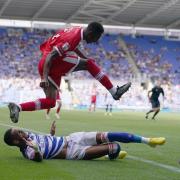 Isaiah Jones hurdles over Tom Ince during Middlesbrough's defeat at Reading