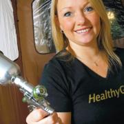 Spray away: Louise Bell of Healthy Glow