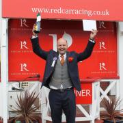 Craig Hudson celebrates his victory in Redcar's Best-Dressed Man contest . Picture: Peter Barron
