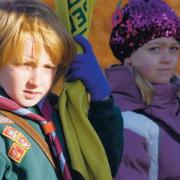 STANDARD BEARERS: Youngsters representing the town’s Cubs and Brownies with their organisations’ flags
