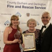 Christine Robson with her daughter Bobbie and Chief Fire Officer Stuart Errington. Picture: Peter Barron