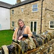 Carly outside her new home in West Witton