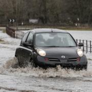 A car drives through floods in Masham in February 2020.