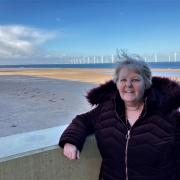 Ruth Fox, chief executive of Footprints in the Community, against the backdrop of the sands at Redcar