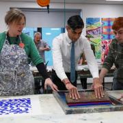 Prime Minister Rishi Sunak attempts screen-printing, during a visit to Northern School of Art in Hartlepool, County Durham.