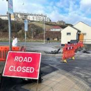 A council whose workmen severed a sewer pipe during a car park extension project is denying liability for the costly blunder.