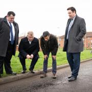 Prime Minister Rishi Sunak with cllr Jonathan Dulston (far left), Tees Valley Mayor Ben Houchen (far right) and Darlington MP Peter Gibson (second from left) in Firthmoor looking at a pothole during a visit to Darlington