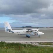 SANDY LANDING: A plane on the seaside runway on Barra, which opened at the same time as Gatwick.