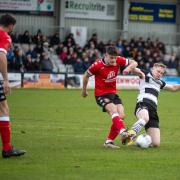 Darlington's Hayden Lindley makes a challenge in his side's defeat to Tamworth