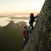 Leo Houlding, pictured here climbing with his son, will share some of his epic life stories