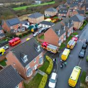 Aerial view of police search at the defendant's home in Ingleby Barwick, last month