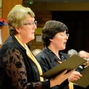 Choir Altos Joy Lynn and Tracy Hopper singing a duet