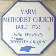 The sign pointing out the 1763 church