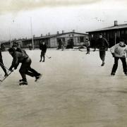 EXERCISE TIME: Prisoners play hockey at a German prison camp. Tom Crandell is thought to be the player on the extreme left