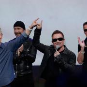 09/09/2014 File Photo of Apple CEO Tim Cook, left, smiling next to U2 members, The Edge, Bono, and Larry Mullen Jr. during an announcement of new products in Cupertino, Calif.   See PA Feature INTERNET Internet Column. Picture credit should read: AP