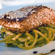 Ginger-glazed salmon with cucumber spaghetti and spring onion crème fraîche